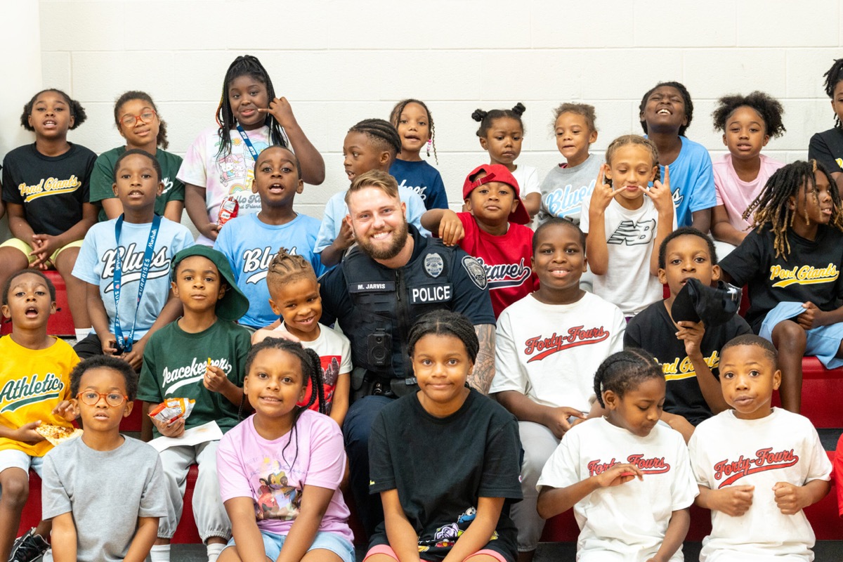 Officer with kids at a community event