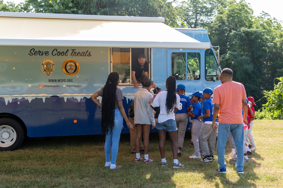 WSPD Serve Cool Treats truck with community members