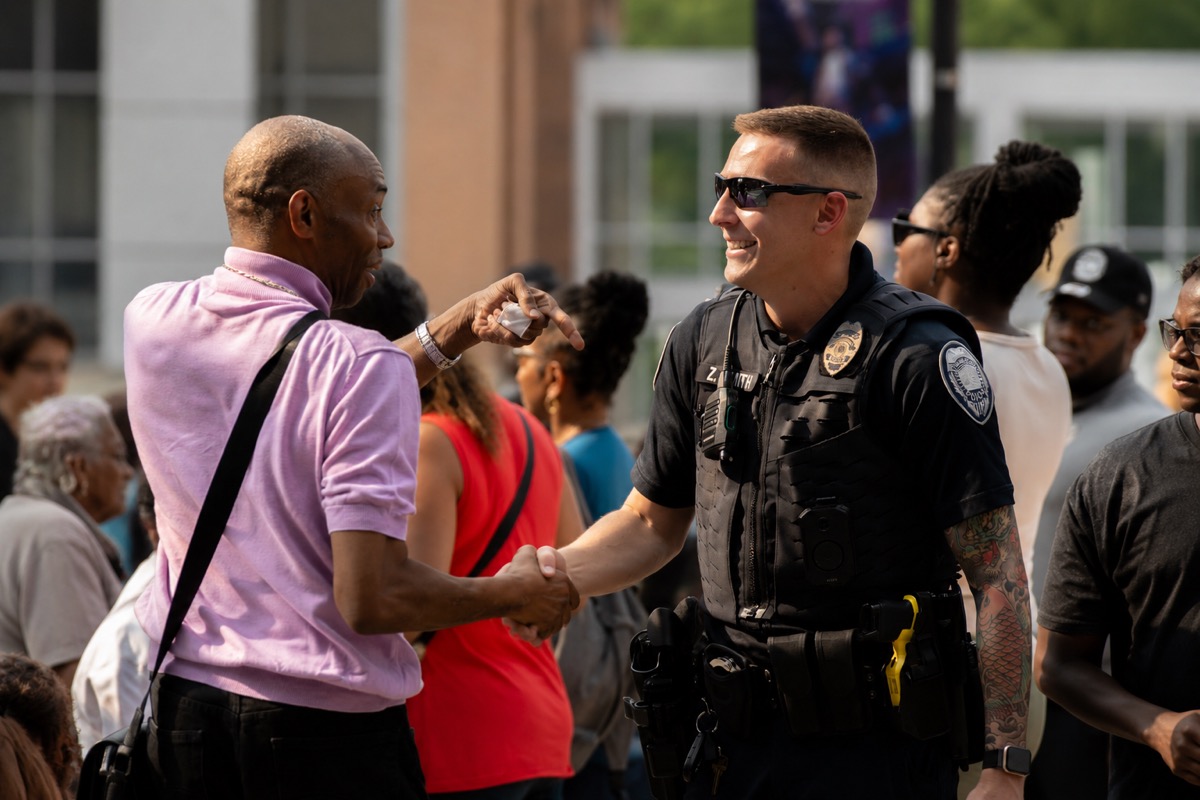 Officer greeting a community member